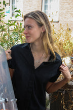 Parelketting op oranje draad met zilveren slot